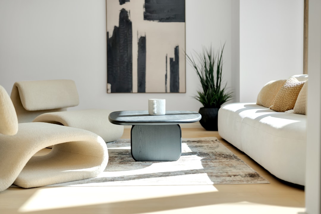Bright, airy, and modern living room with sunlight streaming through the windows, representing a comfortable and energy-ef...